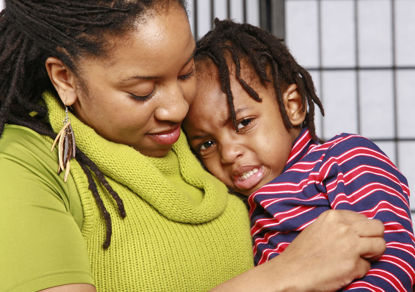 woman comforting child