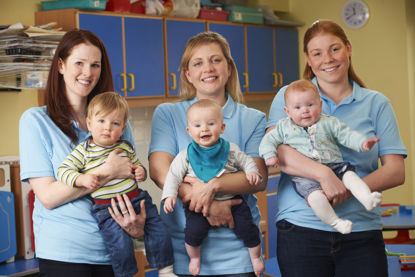 group of women holding children