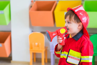 child pretending to be a fireman