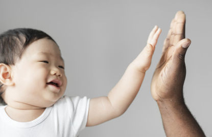 toddler giving a high five