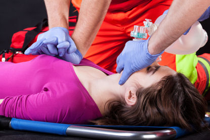 woman being attended to by medical professionals