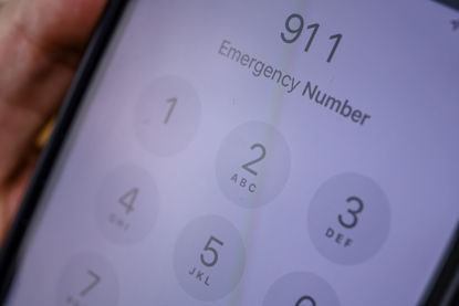 phone with 911 on screen
